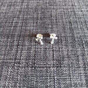 Dainty silver colored cross earrings for pierced ears